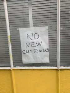 no new customers on window sign